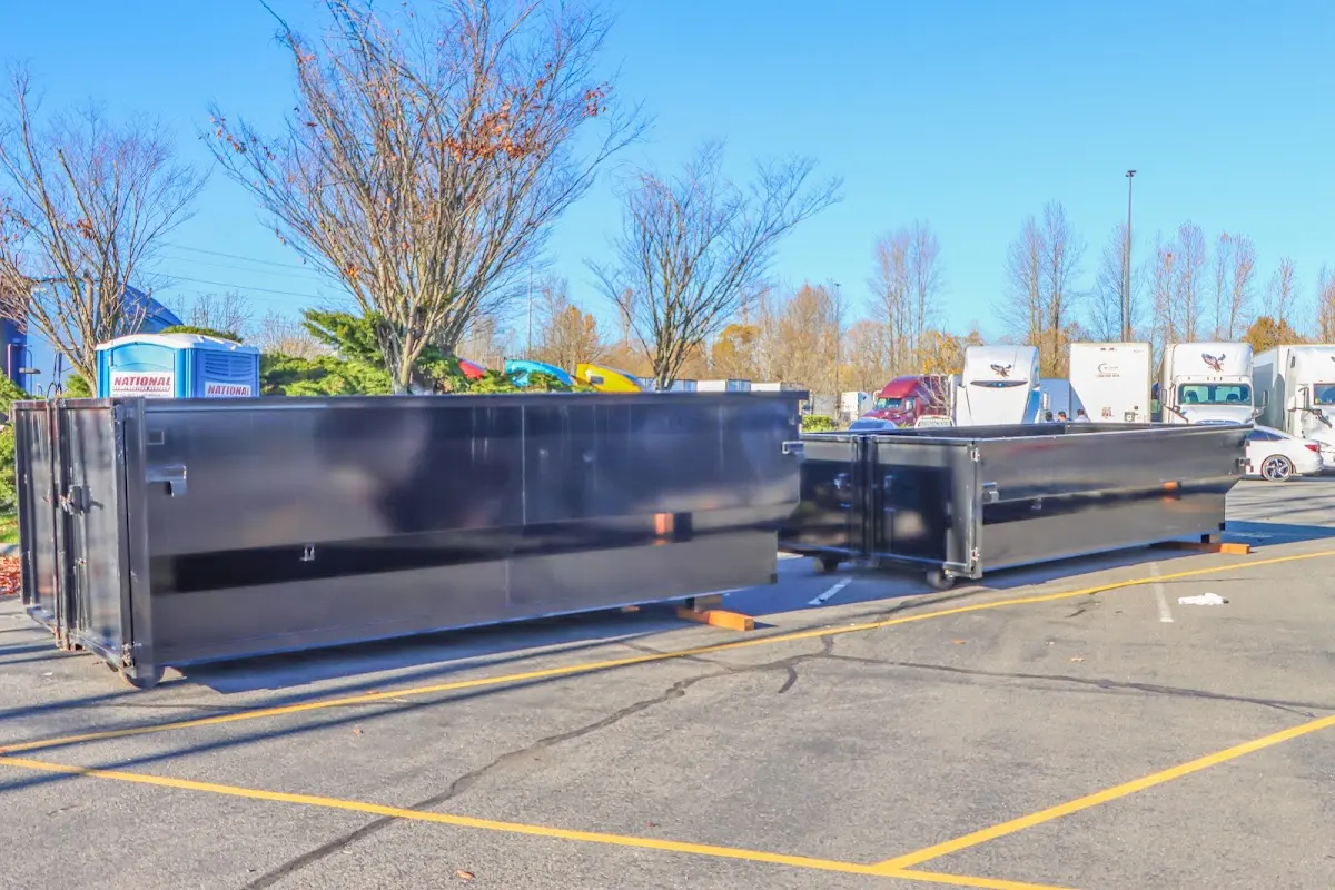 Professional dumpster rental service with roll-off container on residential driveway in Rocklin